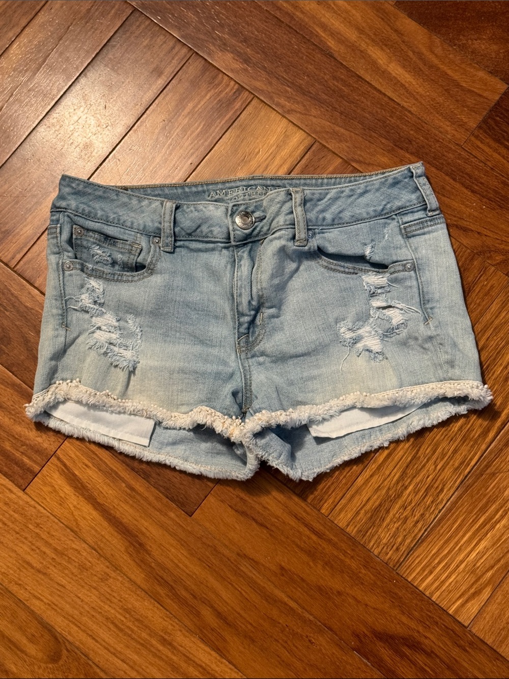 light-wash American Eagle stretch destroyed denim shorts